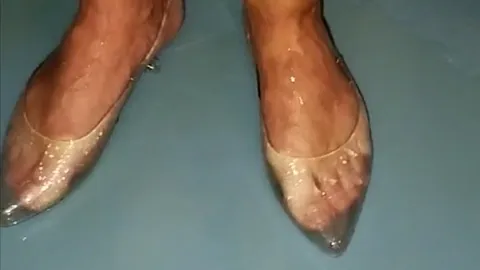 Golden showers in the shower whilst wearing nappy pants, a latex thong, latex gloves and transparent shoes