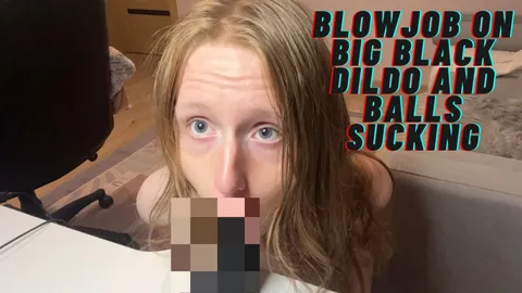Blowjob on big black dildo and balls sucking
