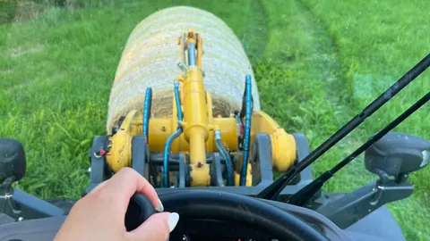 Boobs bounce whilst driving a wheel loader