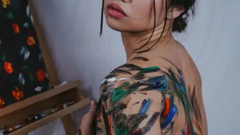 Asian Woman Being Painted Nude
