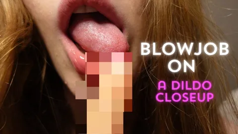 Blowjob on a dildo closeup